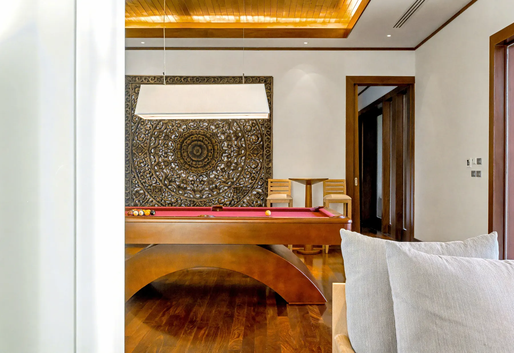 Games lounge with carved wall panel