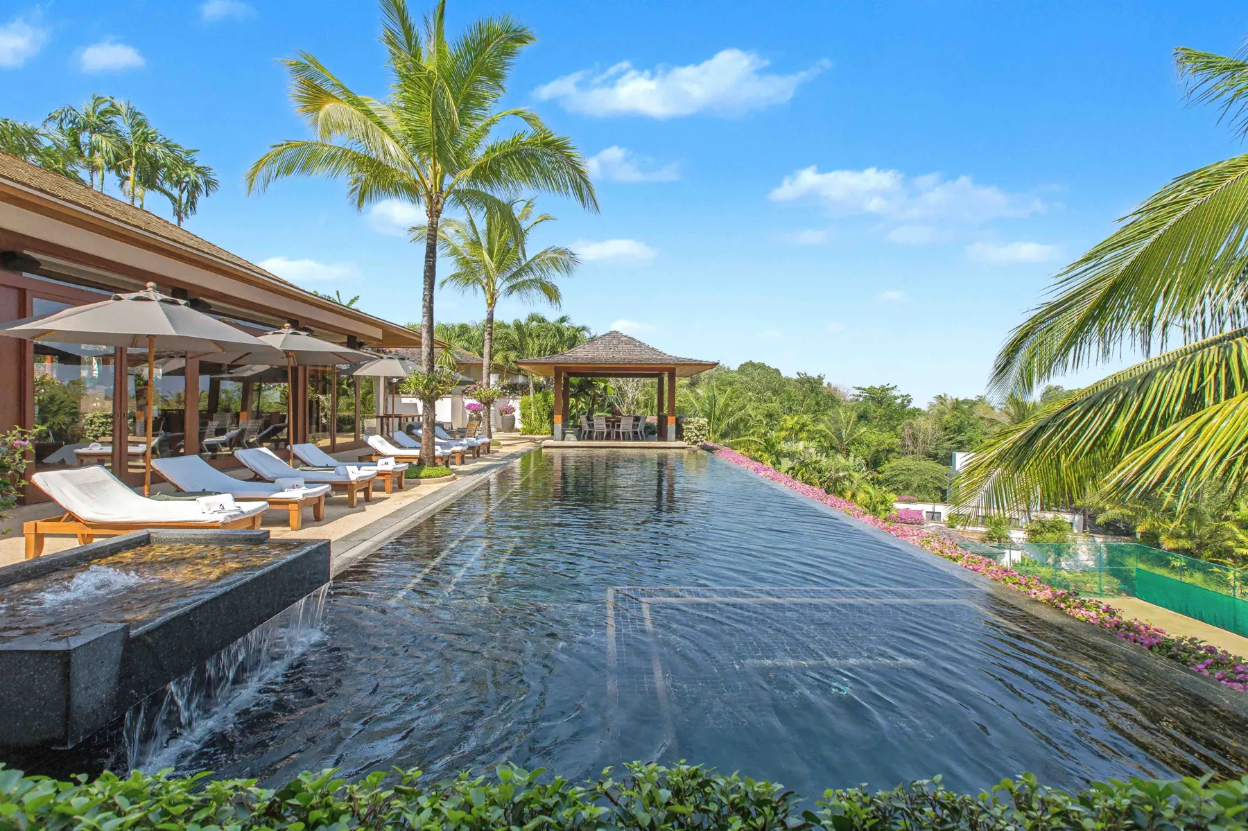18-metre infinity-edge pool with water feature and poolside sala